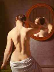 Woman Standing In Front Of A Mirror